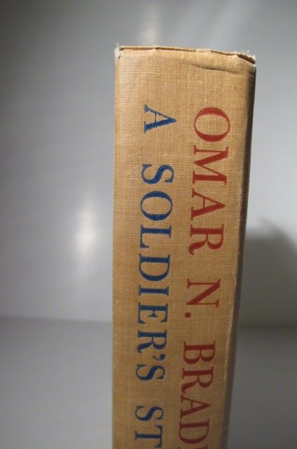 Most notably, this copy is INSCRIBED BY OMAR BRADLEY TO COLONEL JAMES 