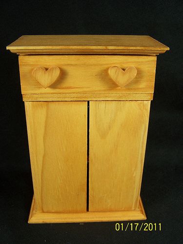   open and top drawer pulls out. The Drawer has two heart handle